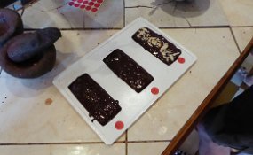 The chocolate poured into the molds Flavorings were added. We picked the finished bars that afternoon and consumed most of them the same evening.