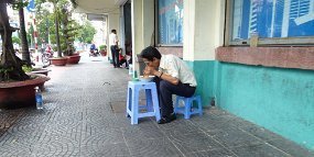 Lunch The tiny table and tiny chair are typical in Vietnam. This is a step up from the standard squat that would be the end of Western knees.